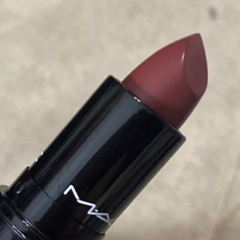 Brand new MAC lipstick. Love me lipstick in the deep wine color “Bated Breath”